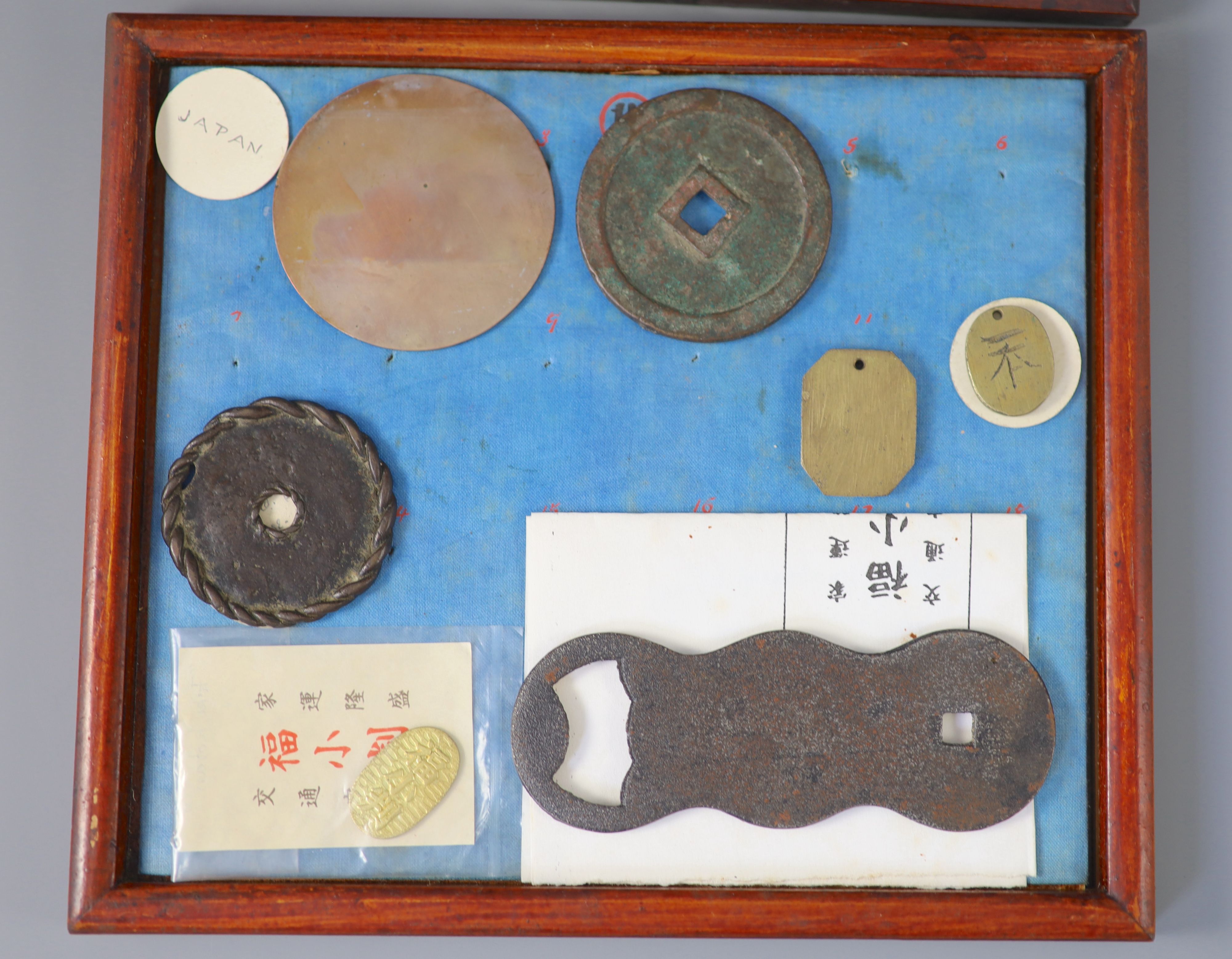A group of 40 Japanese bronze and metal amulets or charms, 19th/20th century,